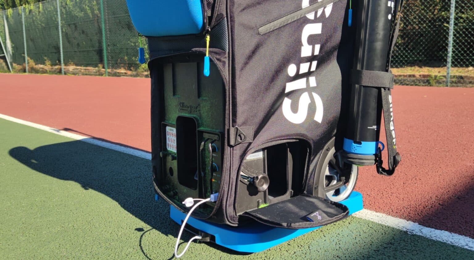 Slinger Portable Tennis Ball Launcher - Ball Throwing Machine With Multi-Function Bag For Tennis Racket And Ball Basket - Remote Control - Large Slam Pack Comes With Oscillator
